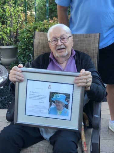Frank on his 100th birthday holding the certificate of congratulations he received from Queen Elizabeth August 5, 2021 in San Diego.